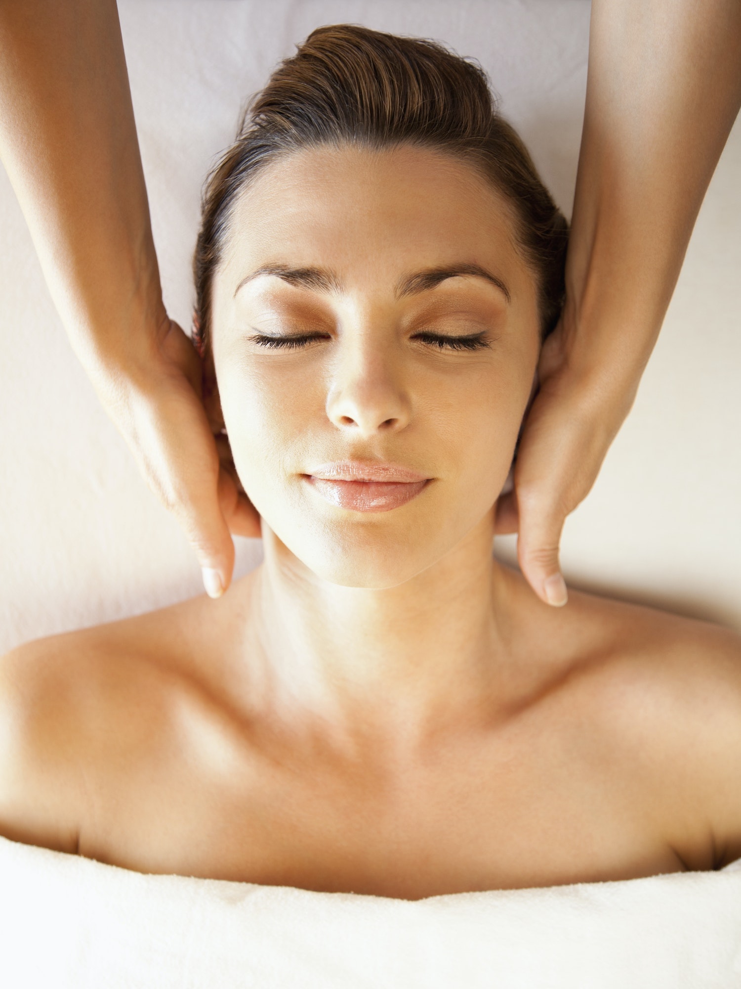 Caucasian woman enjoying head massage
